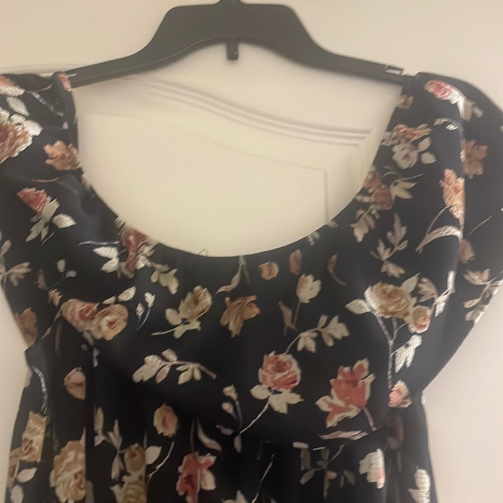Dress that’s long in the back with short in the front. Never worn.